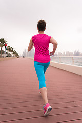 Image showing woman running on the promenade