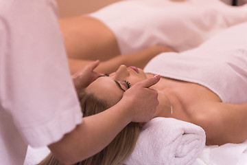 Image showing woman receiving a head massage