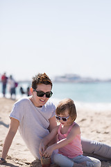 Image showing Mom and daughter on the beach