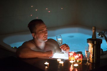 Image showing man relaxing in the jacuzzi