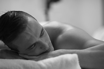 Image showing handsome man resting in a spa massage center