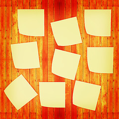 Image showing Mock-up of Sticky note paper on a wooden wall. 3D illustration. 