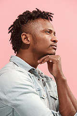 Image showing Young serious thoughtful Afro-American businessman. Doubt concept. Profile view