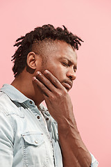 Image showing Young Afro-American man is having toothache.