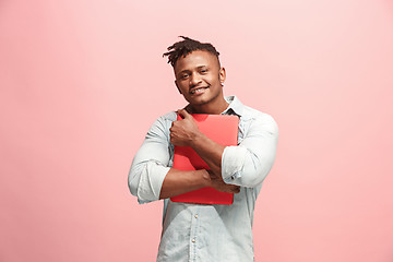 Image showing Afro-American Businessman hugging laptop