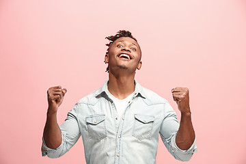 Image showing Winning success man happy ecstatic celebrating being a winner. Dynamic energetic image of male model