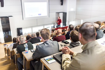 Image showing Business speaker giving a talk at business conference event.