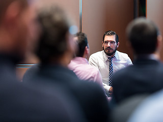 Image showing Skiled Businessman Presenting a Project to His Work Team atl Company Meeting.