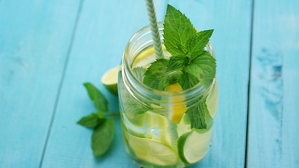 Image showing Refreshing lemonade on blue table 