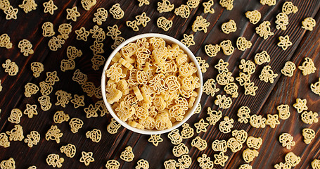 Image showing Bowl of pasta on wooden table