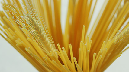 Image showing Bunch of uncooked spaghetti and wheat