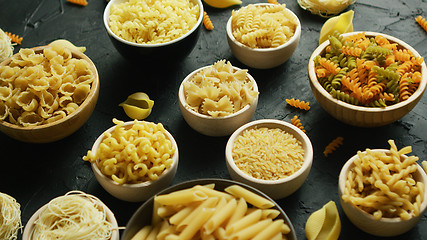 Image showing Different kinds of macaroni put in bowls