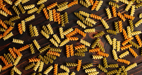 Image showing Messy arrangement of pasta on wood