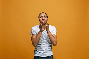 Image showing Portrait of attractive man with kiss isolated over studio background