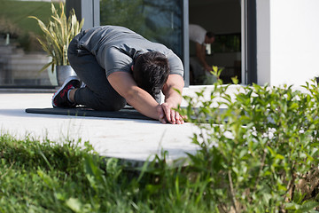 Image showing man doing morning yoga exercises