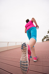 Image showing woman busy running on the promenade