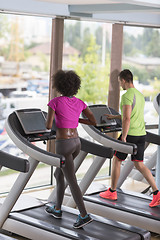 Image showing people exercisinng a cardio on treadmill