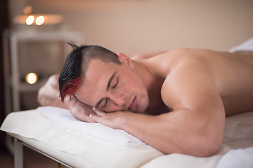 Image showing handsome man resting in a spa massage center