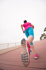 Image showing woman busy running on the promenade