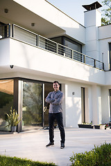 Image showing man in front of his luxury home villa