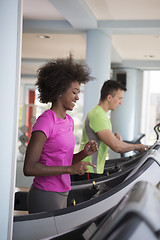 Image showing people exercisinng a cardio on treadmill in gym