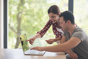 Image showing happy young couple buying online