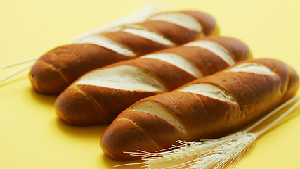 Image showing Golden baguettes and wheat ears