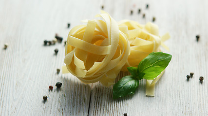 Image showing Small bunches of uncooked pasta