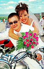 Image showing Bridegroom and bride on the motorcycle