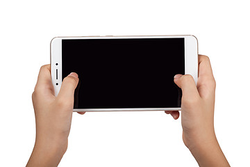 Image showing Child holding a smartphone with both hands