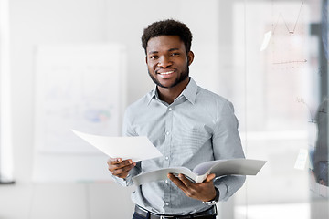 Image showing african american businessman with folder at office