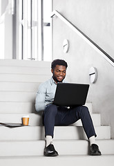 Image showing african american businessman with laptop at office