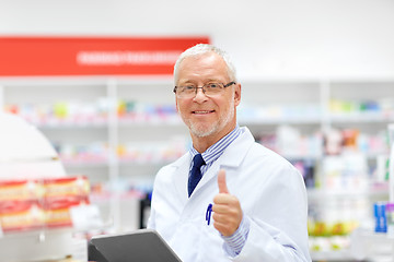 Image showing senior with tablet pc at pharmacy