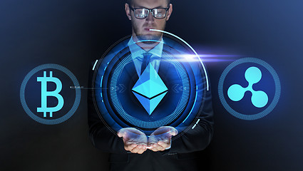 Image showing businessman with at cryptocurrency icons