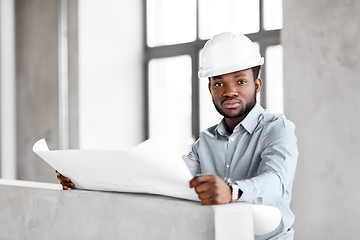 Image showing african architect in helmet with blueprint