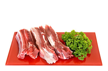 Image showing Pork ribs on red plate