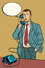 Image showing man talking on a retro phone