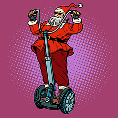 Image showing Santa Claus biker with Christmas gifts rides an electric scooter