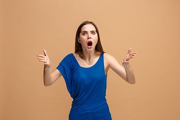 Image showing Portrait of an argue woman looking at camera isolated on a pastel background