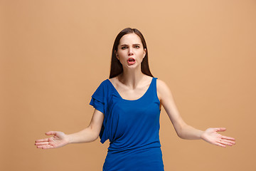 Image showing Portrait of an argue woman looking at camera isolated on a pastel background