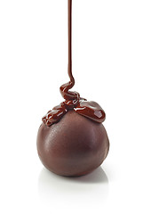 Image showing chocolate truffles covered with melted chocolate