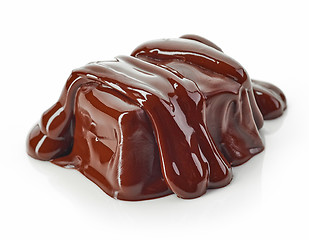 Image showing piece of chocolate covered with melted chocolate