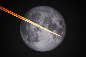 Image showing a plane flight in front of the full moon by night sky