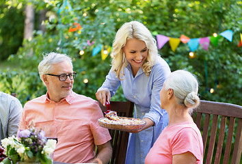 Image showing happy family having dinner or summer garden party