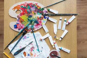 Image showing palette, brushes and paint tubes on table