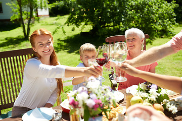 Image showing happy family having dinner or summer garden party