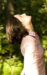 Image showing woman looking upwards
