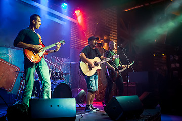 Image showing Band performs on stage in a nightclub