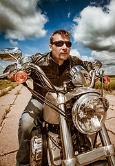 Image showing Biker racing on the road