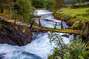 Image showing Suspension bridge over the mountain river, Norway.